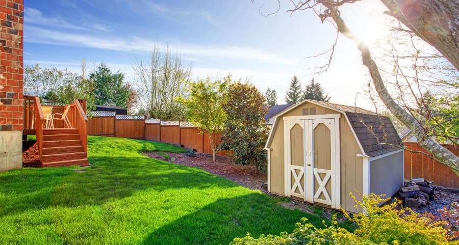 Fenced backyard with storage shed in Duluth